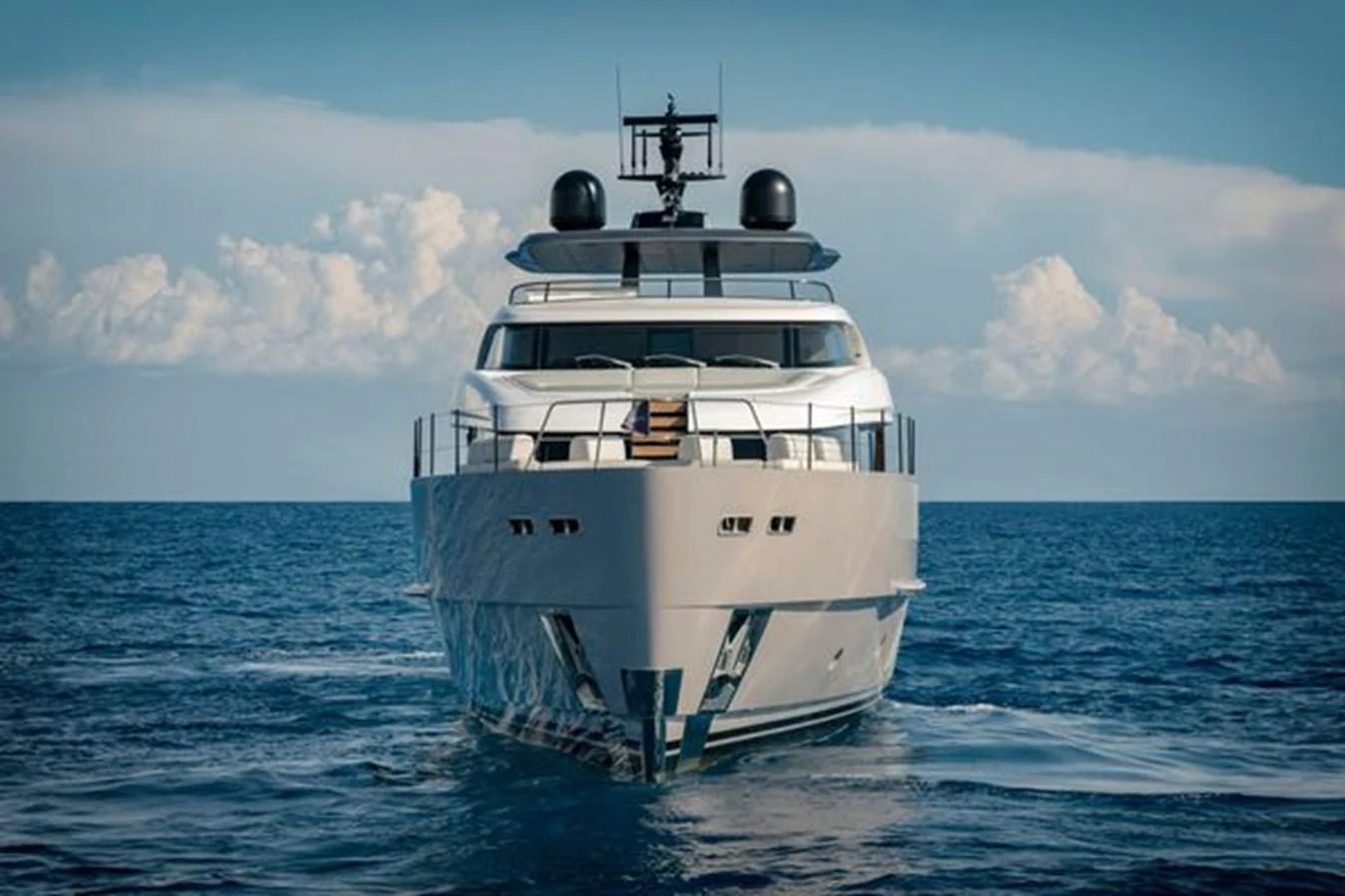 A sleek and modern yacht cruising on open waters under a clear sky. aboard 2025 SANLORENZO SD90 #180 Yacht for Sale