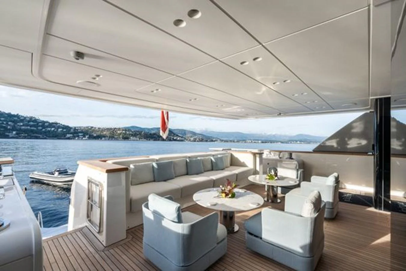 The aft deck offers a spacious and elegant outdoor seating area with stunning views of the water. aboard 2022 SANLORENZO SD118 Yacht for Sale