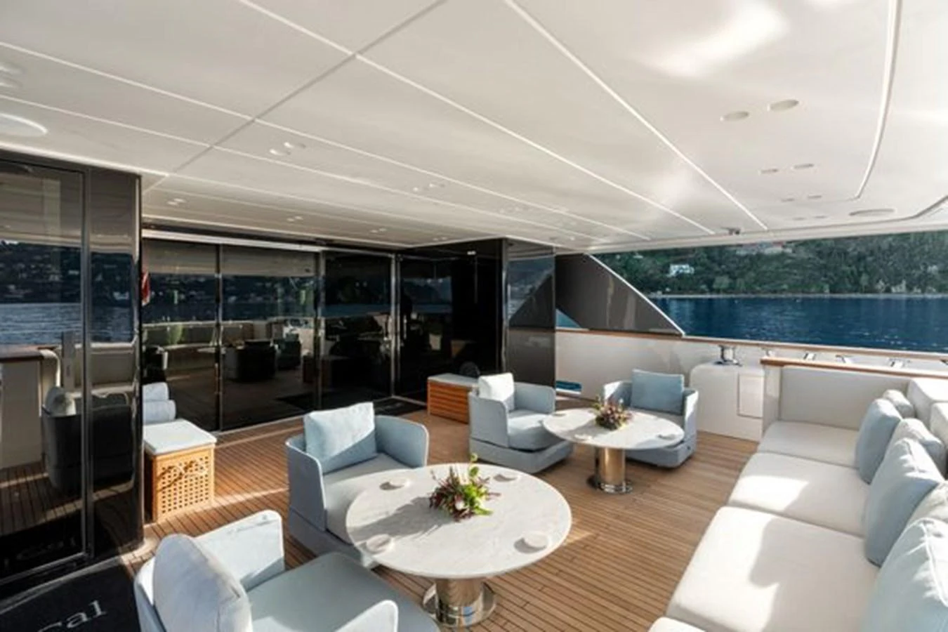 The aft deck features comfortable seating areas and elegant tables, perfect for relaxation and socializing. aboard 2022 SANLORENZO SD118 Yacht for Sale