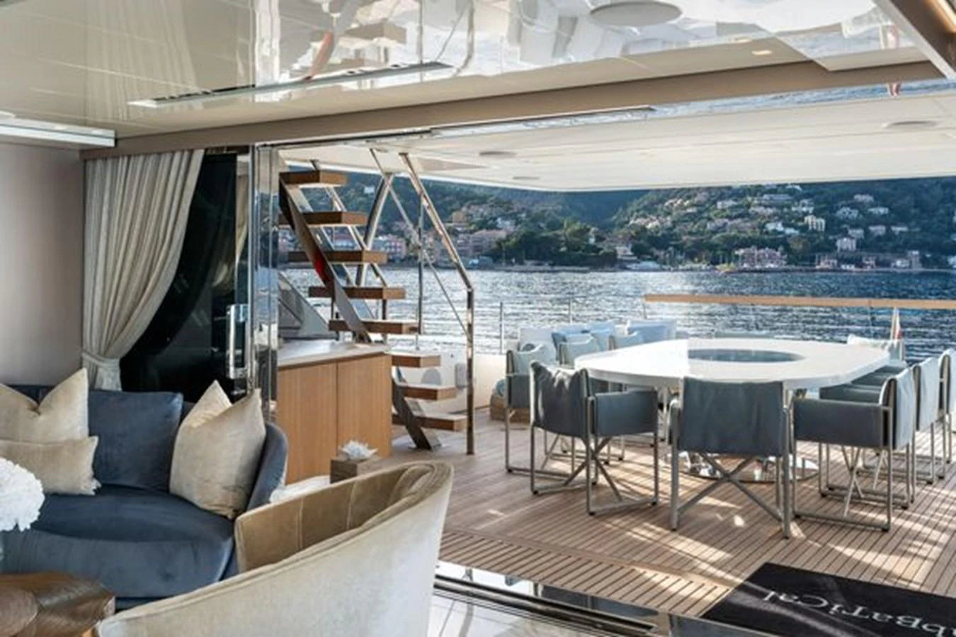 The spacious salon seamlessly transitions to the aft deck, offering stunning views and ample seating. aboard 2022 SANLORENZO SD118 Yacht for Sale