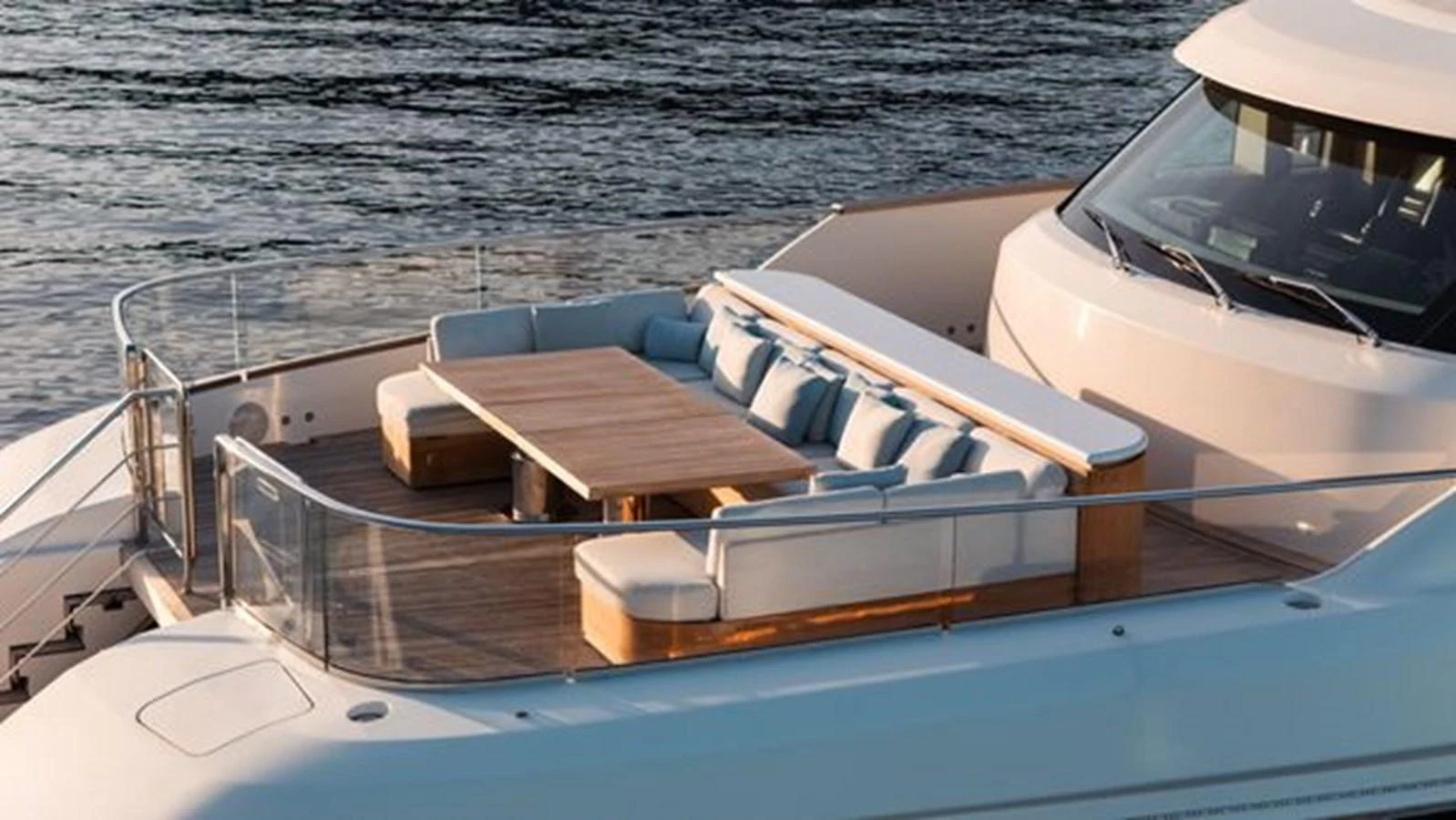 The yacht features an elegant aft deck with a spacious dining area overlooking the water. aboard 2022 SANLORENZO SD118 Yacht for Sale