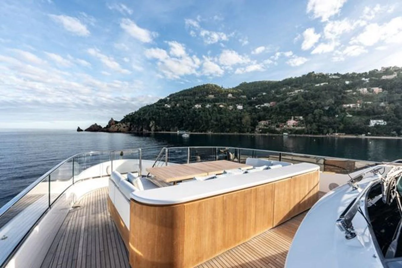 The yacht's sundeck offers a spacious and luxurious area for relaxation with stunning views of the surrounding landscape. aboard 2022 SANLORENZO SD118 Yacht for Sale