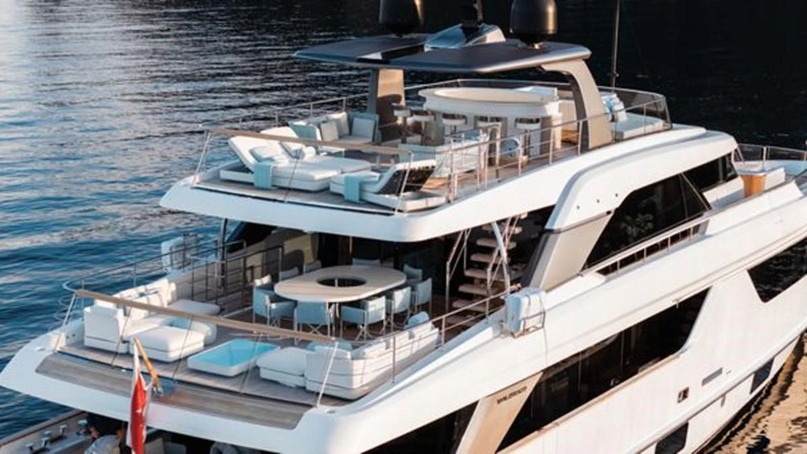 This luxurious yacht features an expansive aft deck with multiple lounging and dining areas, perfect for entertaining on the water. aboard 2022 SANLORENZO SD118 Yacht for Sale