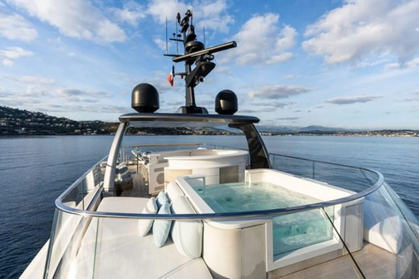 The sundeck features a luxurious jacuzzi with panoramic views of the surrounding waters. aboard 2022 SANLORENZO SD118 Yacht for Sale