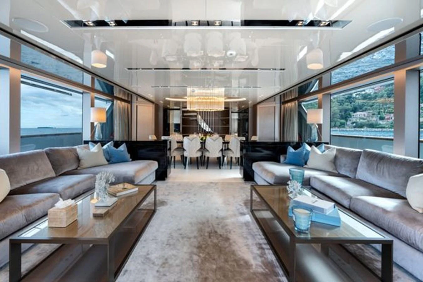 The salon features luxurious seating with panoramic windows offering stunning views. aboard 2022 SANLORENZO SD118 Yacht for Sale