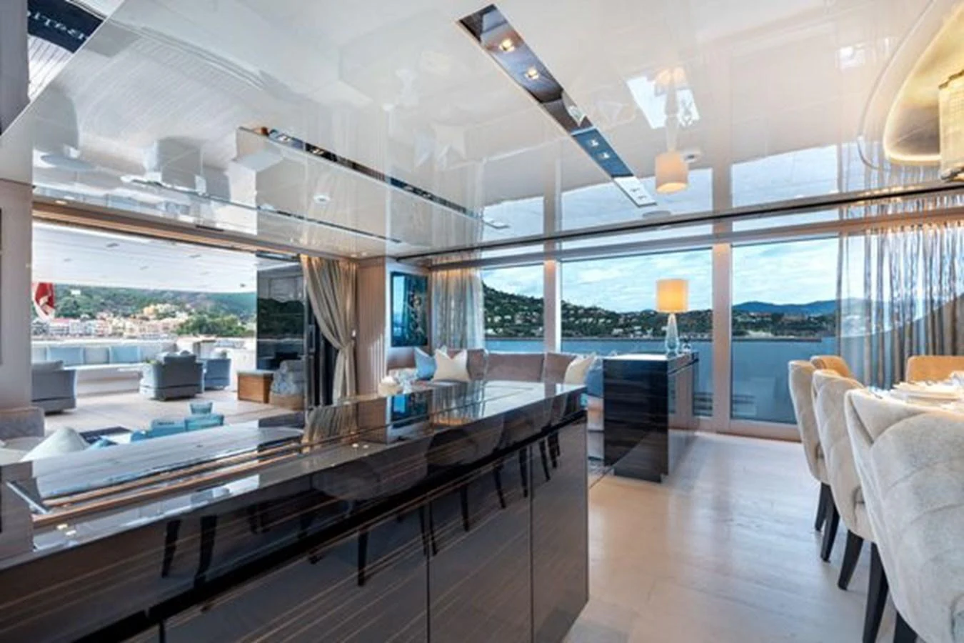 The yacht's salon features a spacious and elegant design with large windows offering stunning views. aboard 2022 SANLORENZO SD118 Yacht for Sale