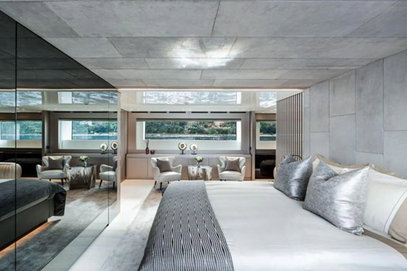 The master stateroom features luxurious bedding and expansive windows with a serene view. aboard 2022 SANLORENZO SD118 Yacht for Sale
