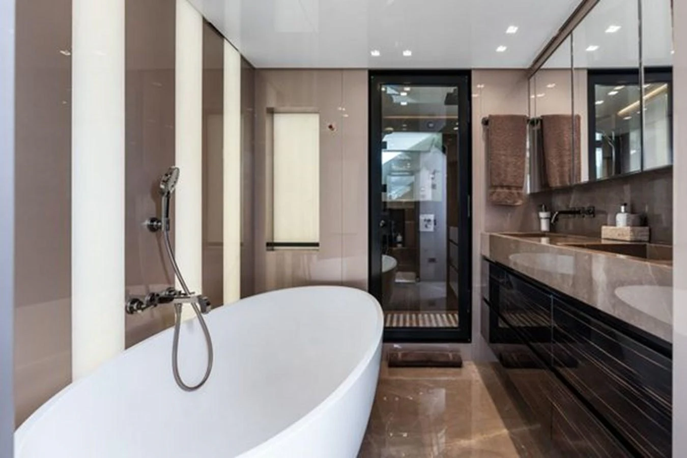The yacht's bathroom features a sleek, modern design with a luxurious bathtub and elegant fixtures. aboard 2022 SANLORENZO SD118 Yacht for Sale