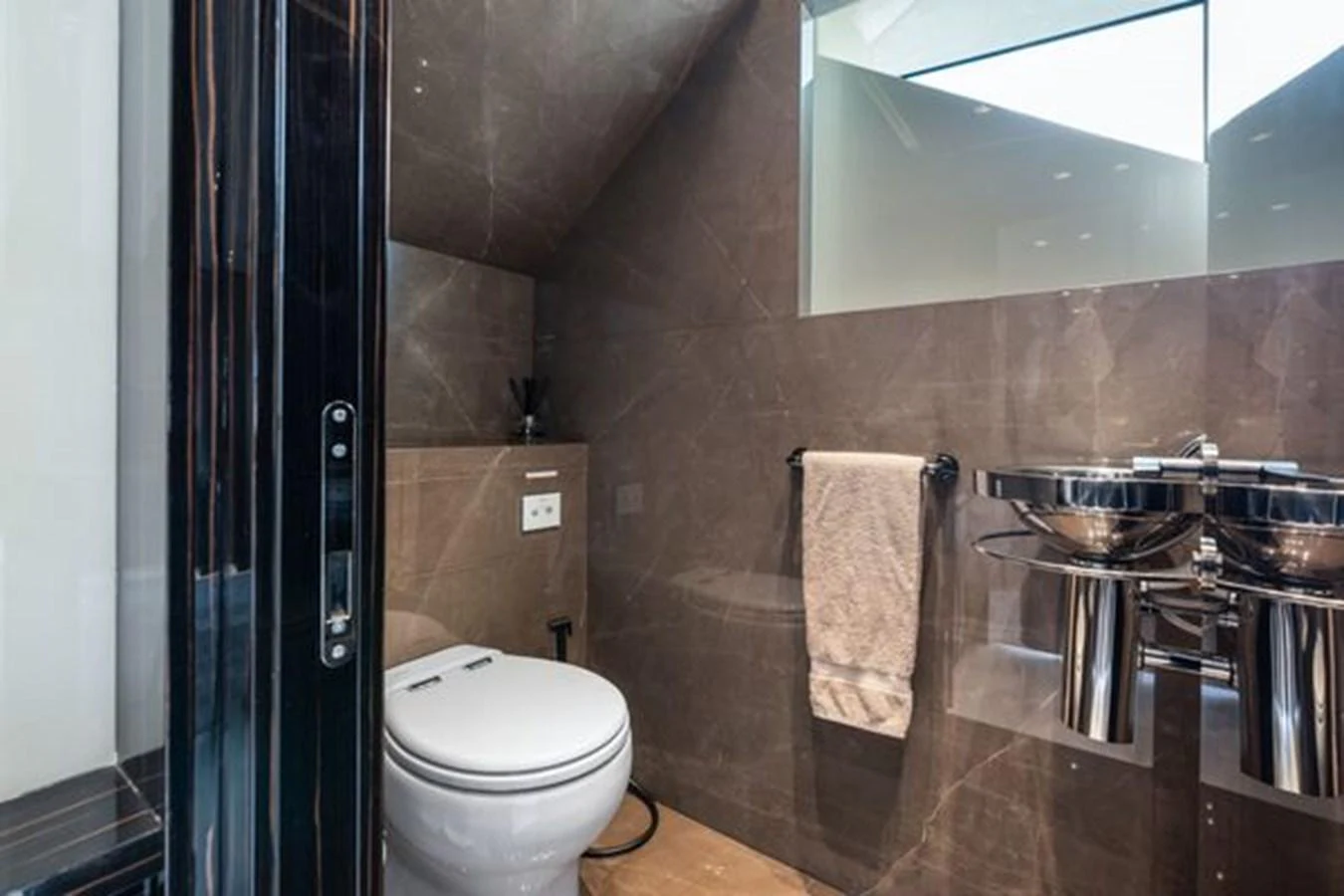The yacht's bathroom features modern fixtures and a sleek design. aboard 2022 SANLORENZO SD118 Yacht for Sale