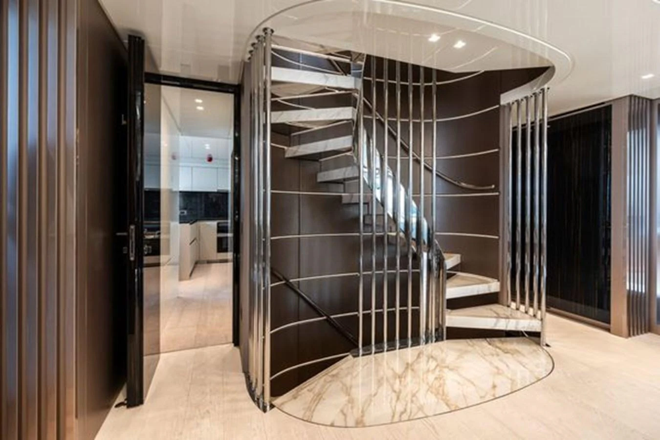 A luxurious interior staircase with modern design elements and elegant finishes. aboard 2022 SANLORENZO SD118 Yacht for Sale