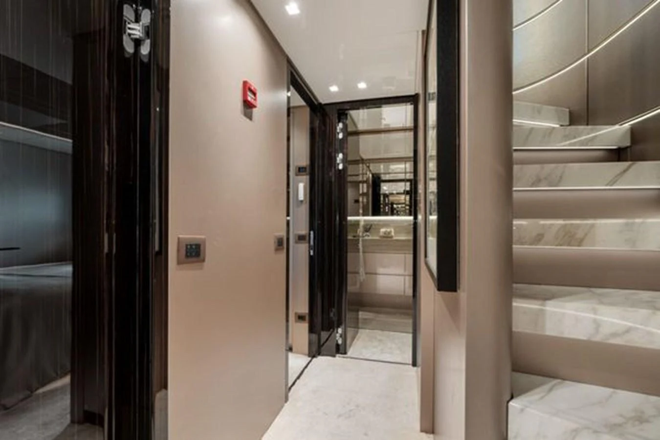 A luxurious interior hallway featuring a modern staircase and elegant finishes. aboard 2022 SANLORENZO SD118 Yacht for Sale
