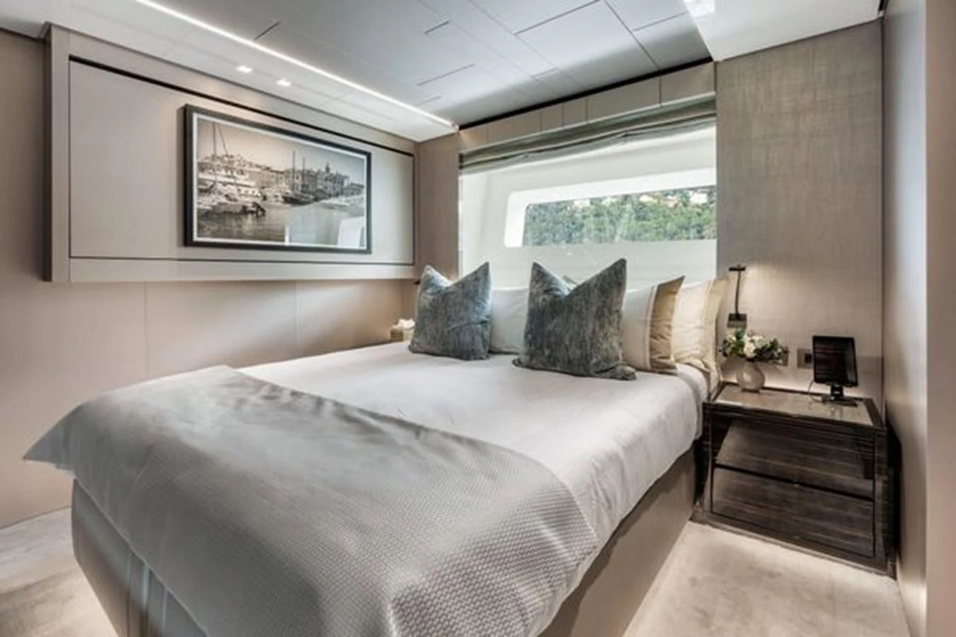 A luxurious stateroom featuring a large bed, elegant decor, and a scenic window view. aboard 2022 SANLORENZO SD118 Yacht for Sale