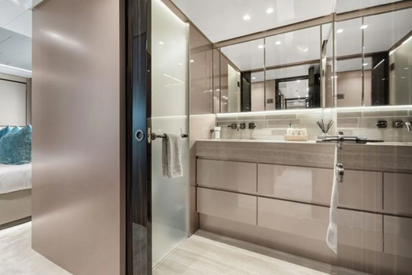 The yacht's bathroom features sleek modern design with ample storage and a spacious layout. aboard 2022 SANLORENZO SD118 Yacht for Sale