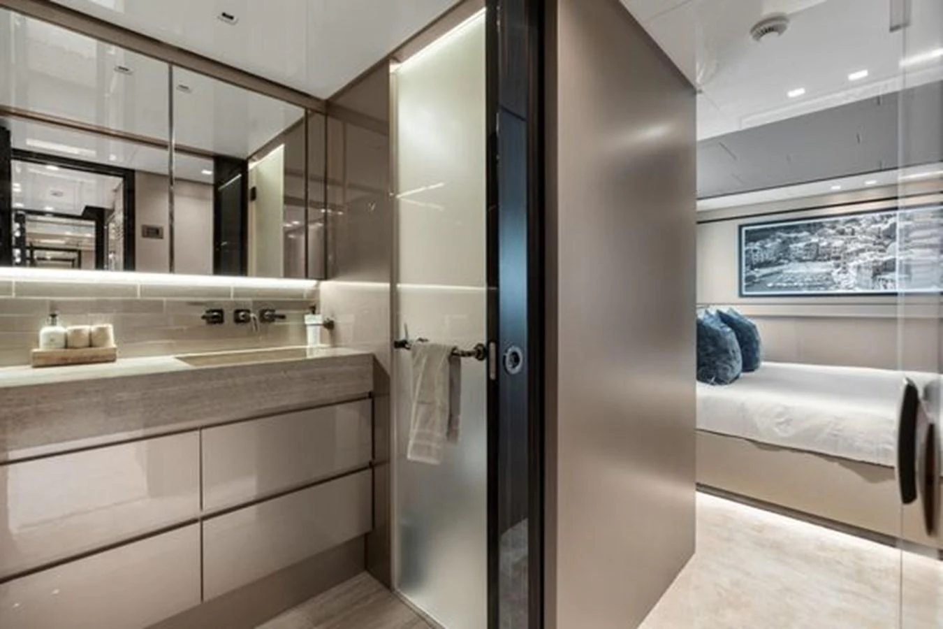 A luxurious stateroom with an en-suite bathroom featuring modern fixtures and elegant decor. aboard 2022 SANLORENZO SD118 Yacht for Sale