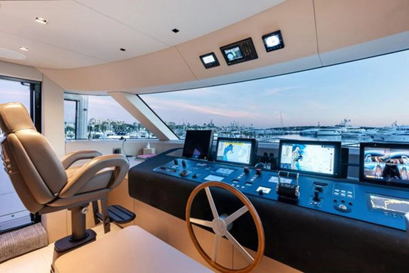 The helm station offers a panoramic view with state-of-the-art navigation equipment and a luxurious captain's chair. aboard 2022 SANLORENZO SD118 Yacht for Sale