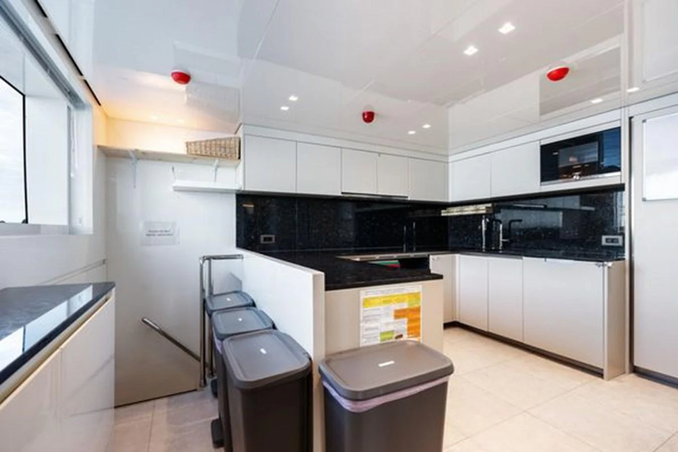 The galley features modern appliances and ample counter space for meal preparation. aboard 2022 SANLORENZO SD118 Yacht for Sale
