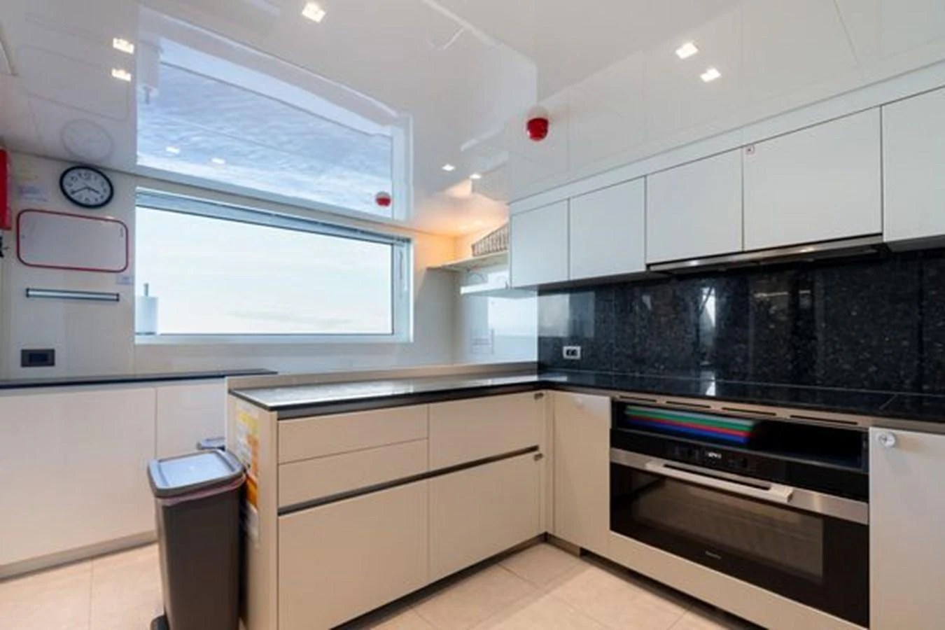 The modern galley features sleek cabinetry, high-end appliances, and ample counter space. aboard 2022 SANLORENZO SD118 Yacht for Sale