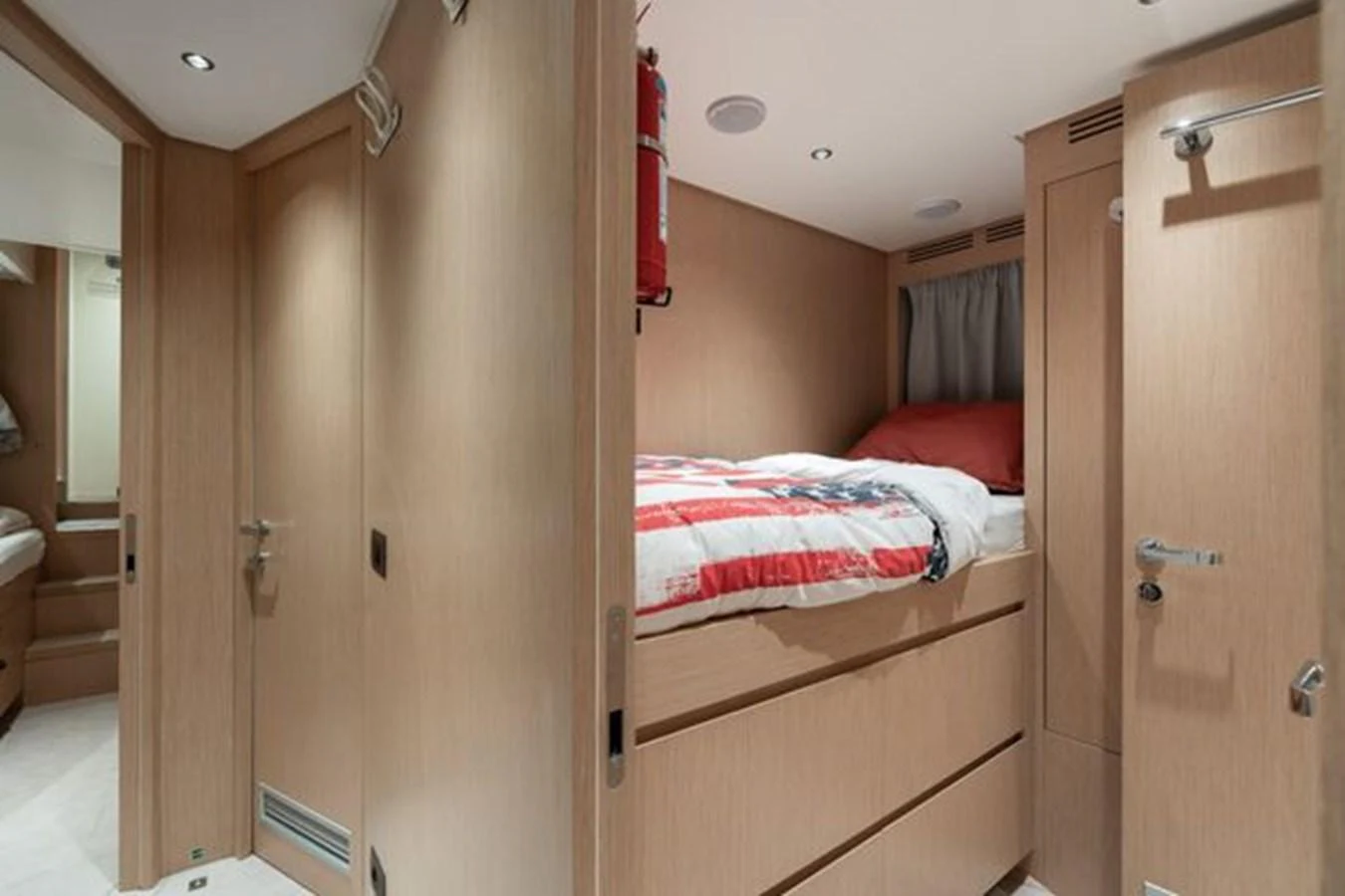 A cozy cabin with a neatly made bed and ample storage space. aboard 2022 SANLORENZO SD118 Yacht for Sale