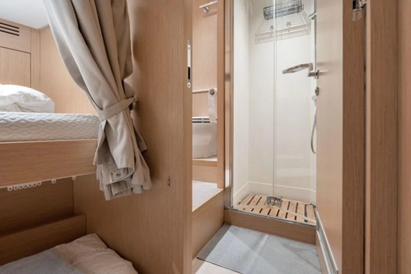 The yacht's bathroom features a modern shower and wooden accents. aboard 2022 SANLORENZO SD118 Yacht for Sale