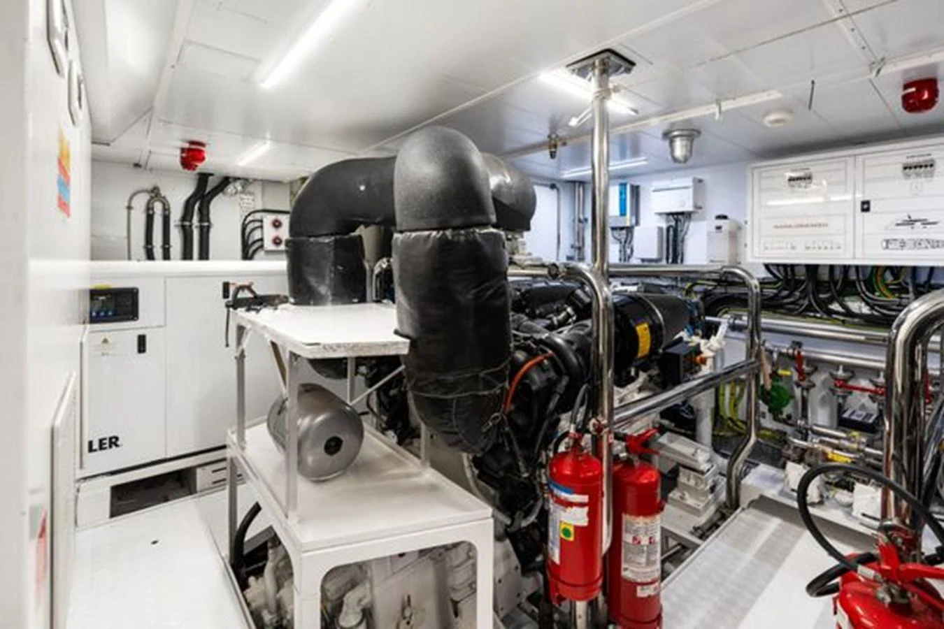 The image showcases the well-maintained engine room of the yacht, highlighting its advanced machinery and safety equipment. aboard 2022 SANLORENZO SD118 Yacht for Sale