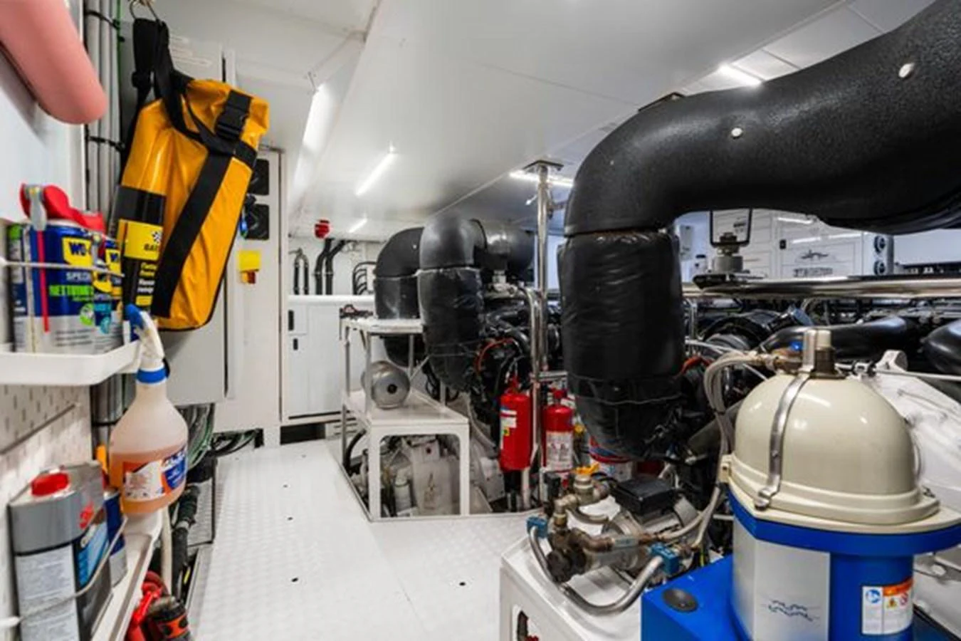 The image showcases a well-organized engine room with various equipment and safety gear. aboard 2022 SANLORENZO SD118 Yacht for Sale