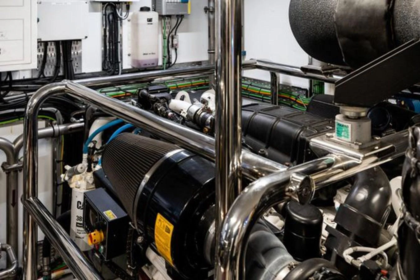 The image showcases the well-maintained engine room of the yacht, highlighting its advanced machinery and clean setup. aboard 2022 SANLORENZO SD118 Yacht for Sale