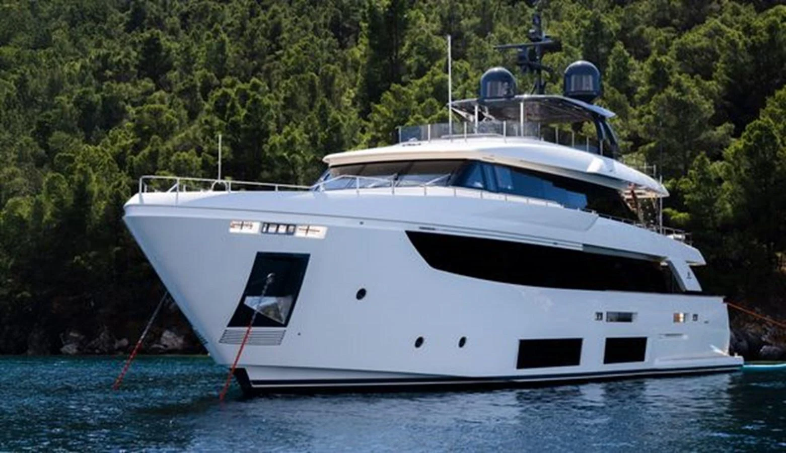 a white boat in the water aboard SK Yacht for Sale