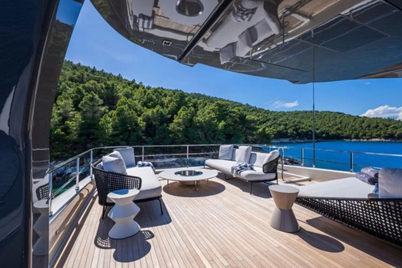 a room with a table and chairs aboard SK Yacht for Sale