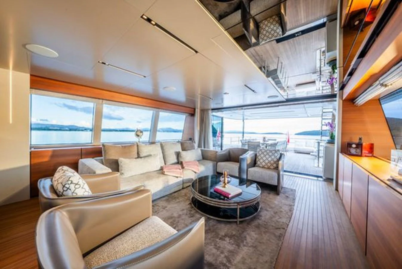 a living room with a large window aboard SK Yacht for Sale