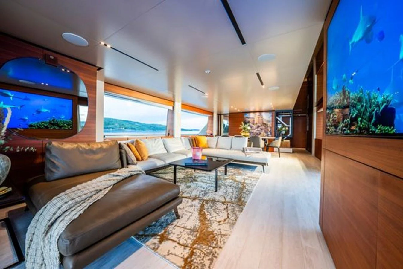 a living room with a large window aboard SK Yacht for Sale