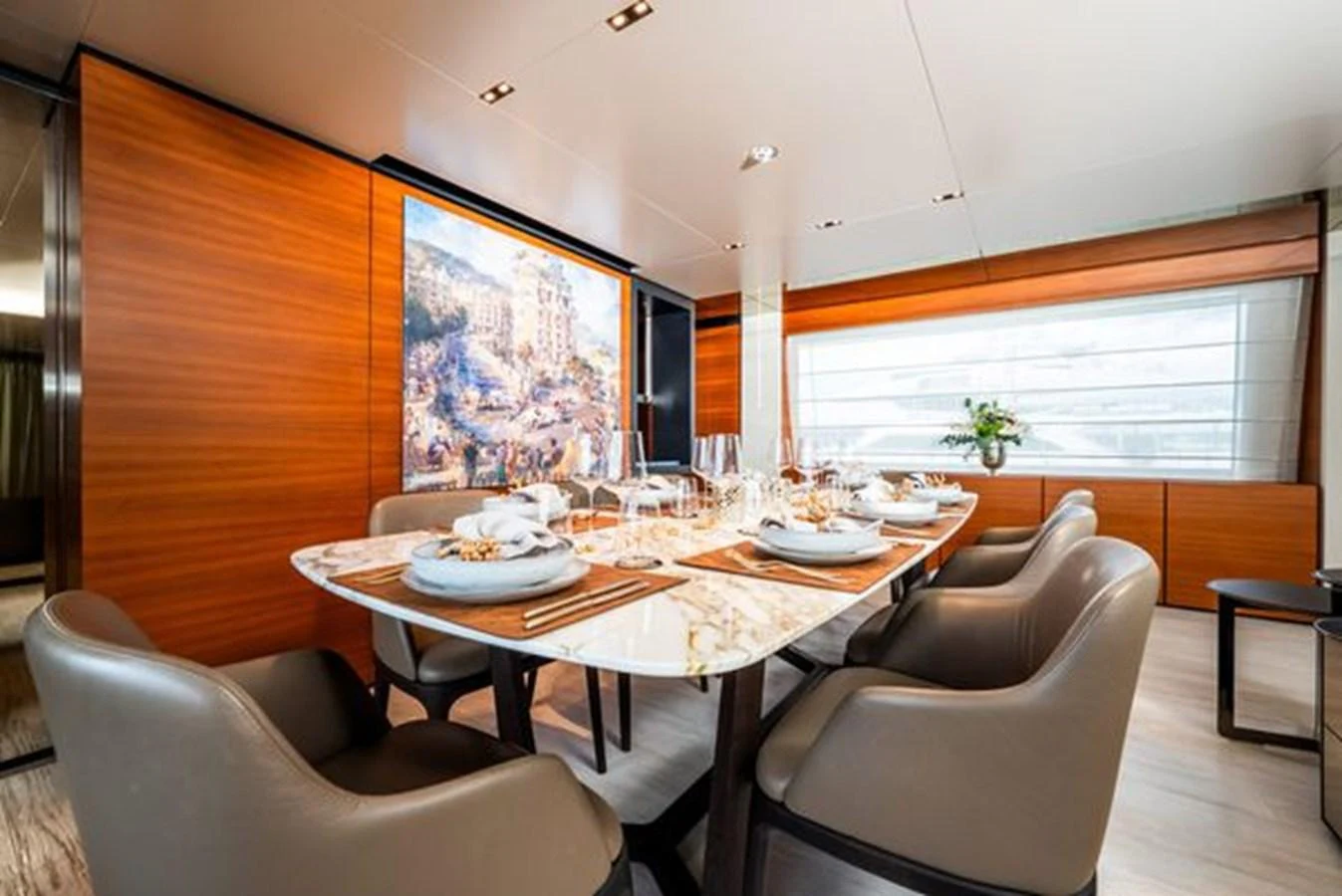 a dining room with a table and chairs aboard SK Yacht for Sale