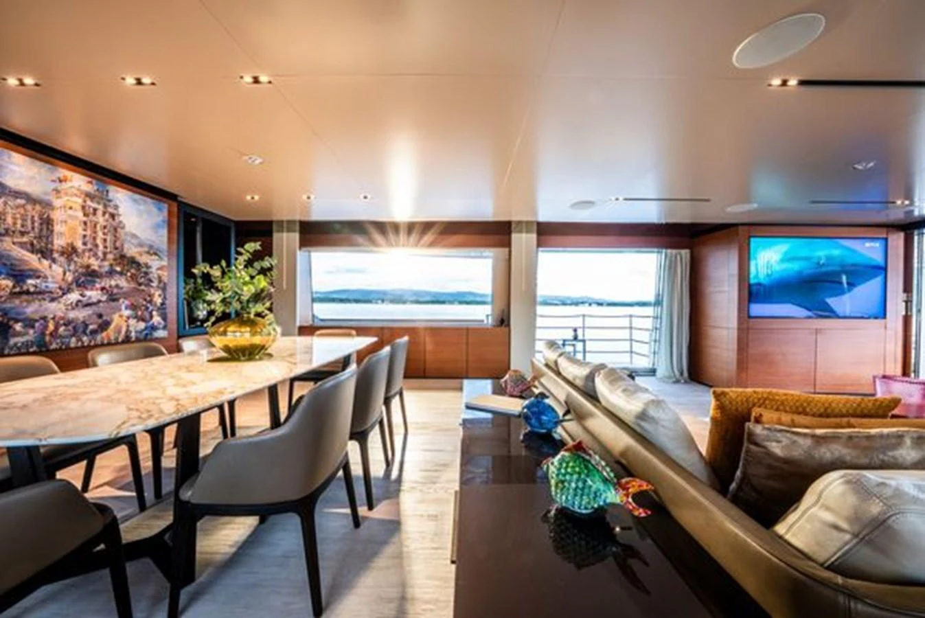 a living room with a couch and a tv aboard SK Yacht for Sale