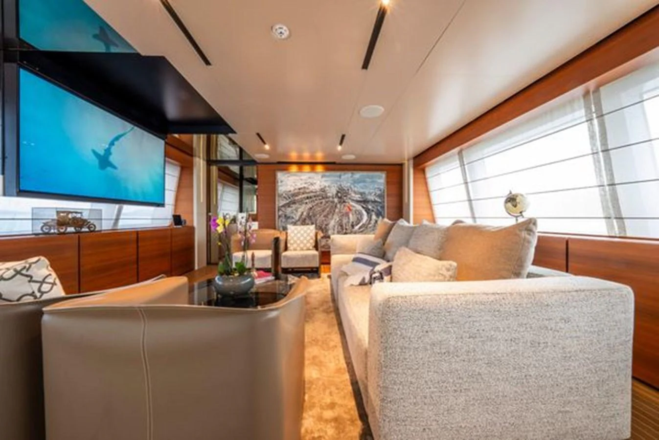 a living room with a large tv aboard SK Yacht for Sale