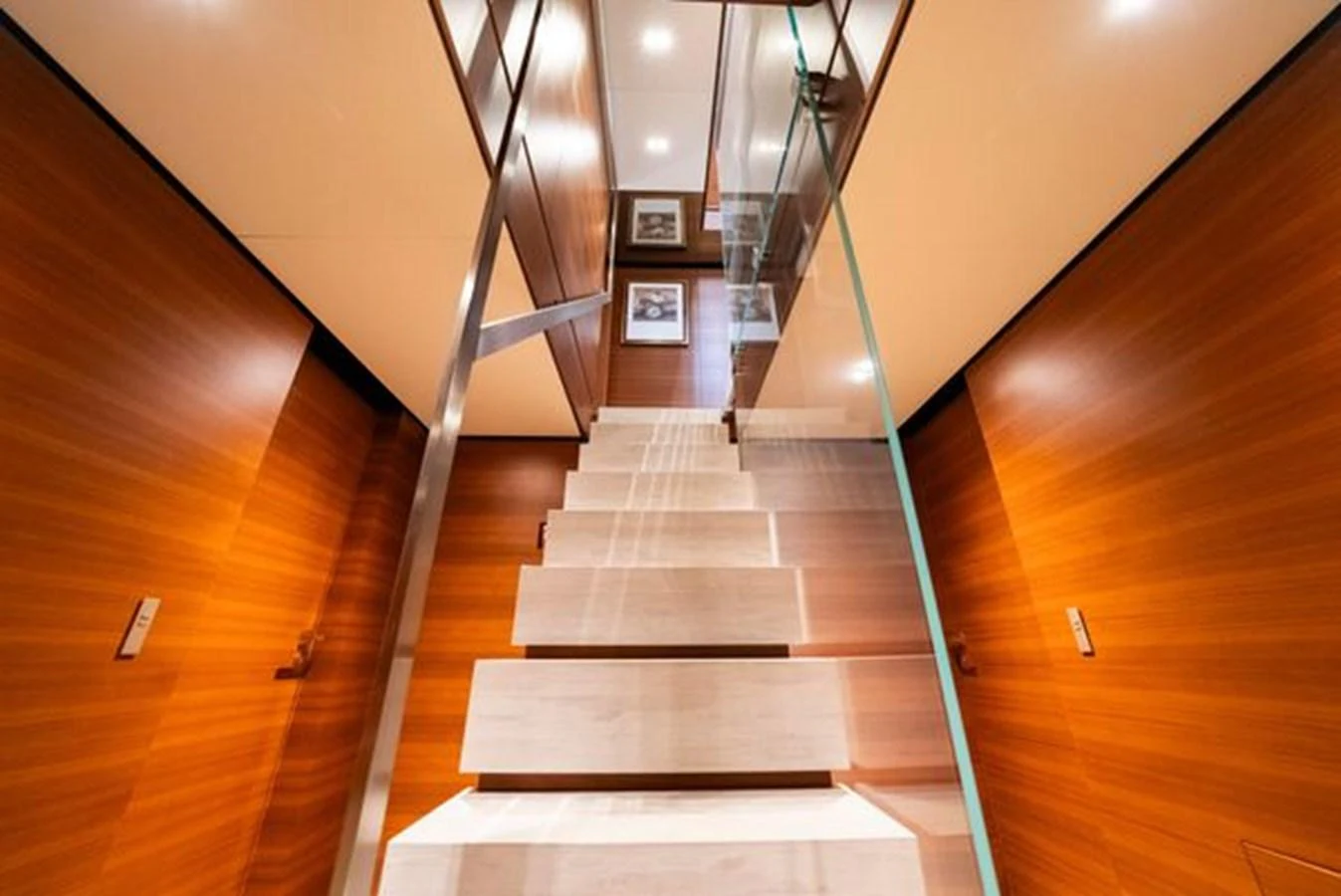 a long wooden staircase aboard SK Yacht for Sale