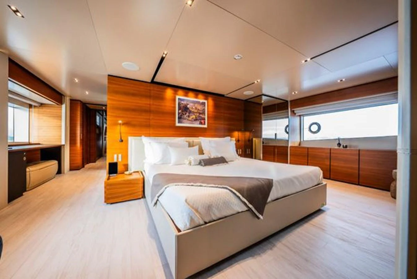 a bedroom with a large bed aboard SK Yacht for Sale