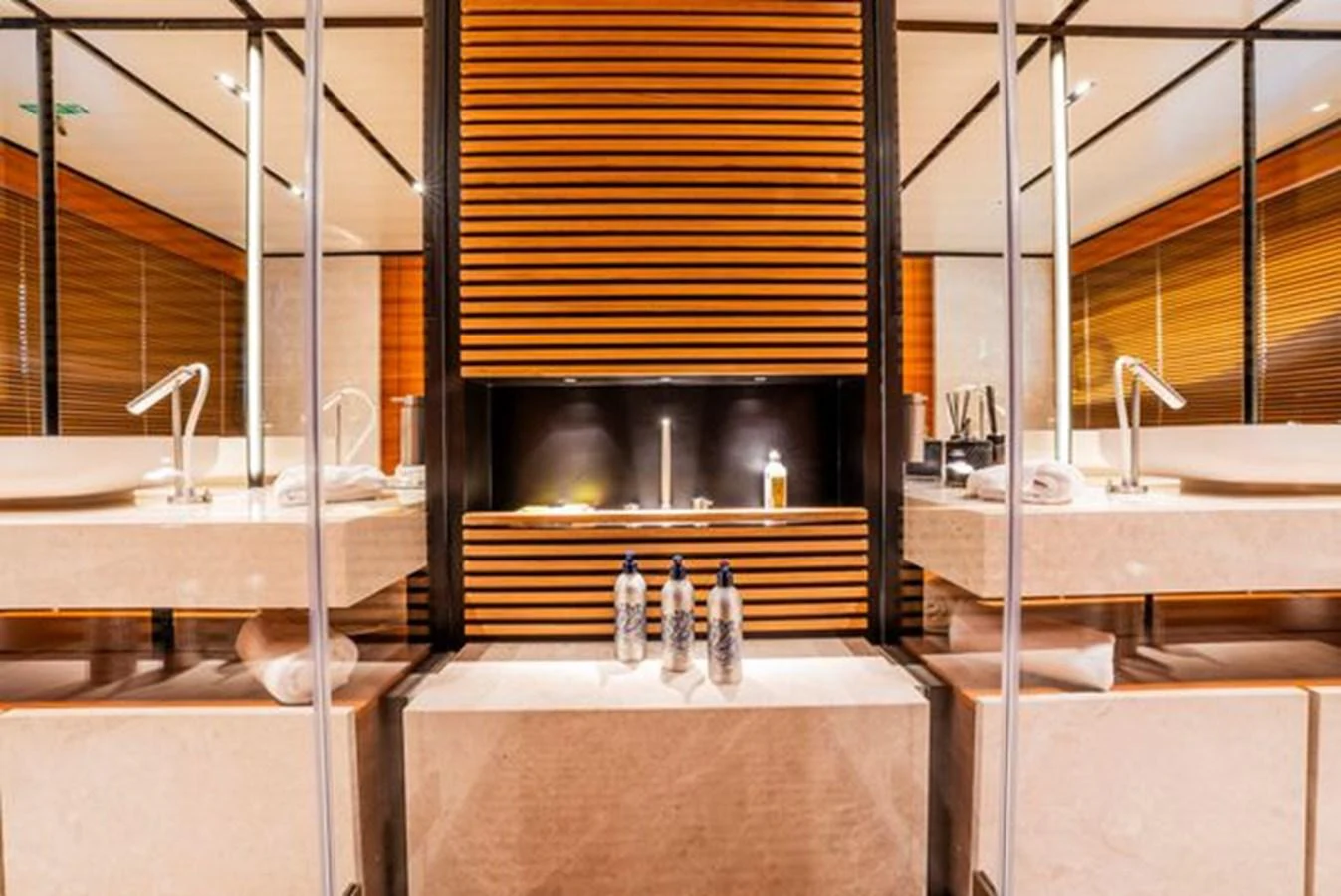 a bathroom with a countertop sink and a large mirror aboard SK Yacht for Sale