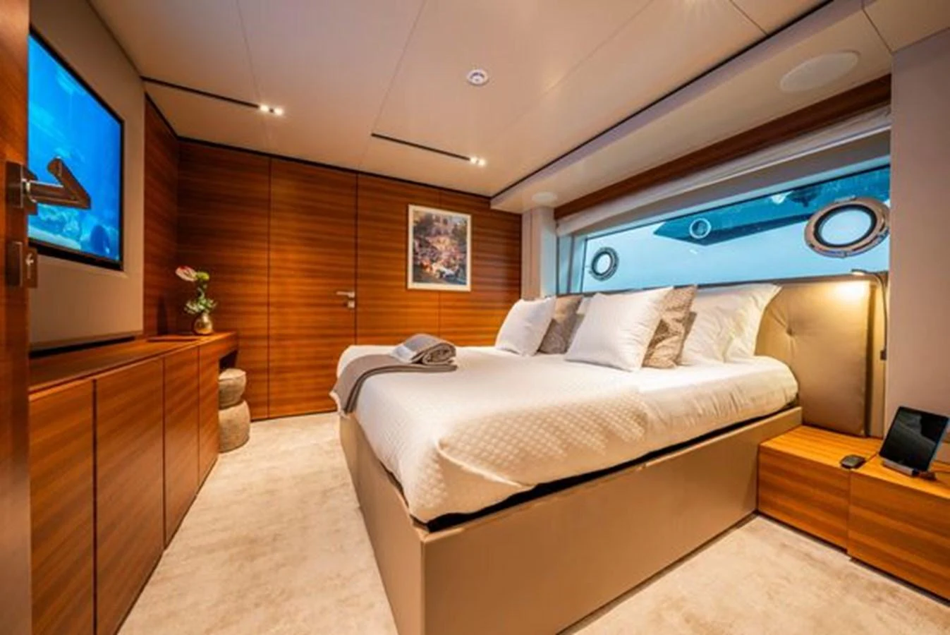 a room with a bed and a tv aboard SK Yacht for Sale