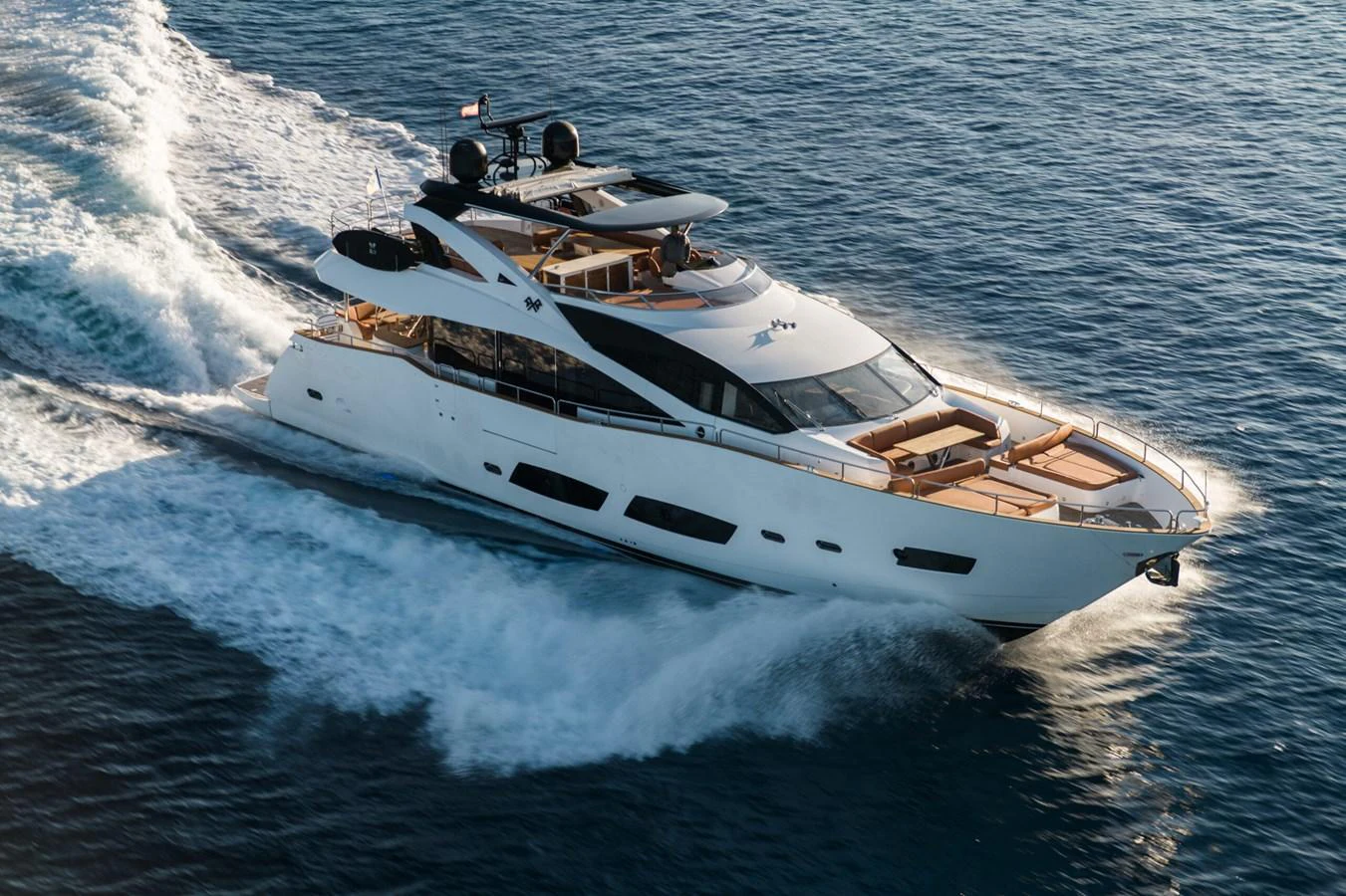 A sleek yacht cruises swiftly through the water, showcasing its modern design and luxurious amenities. aboard 2015 SUNSEEKER 28M RIII Yacht for Sale