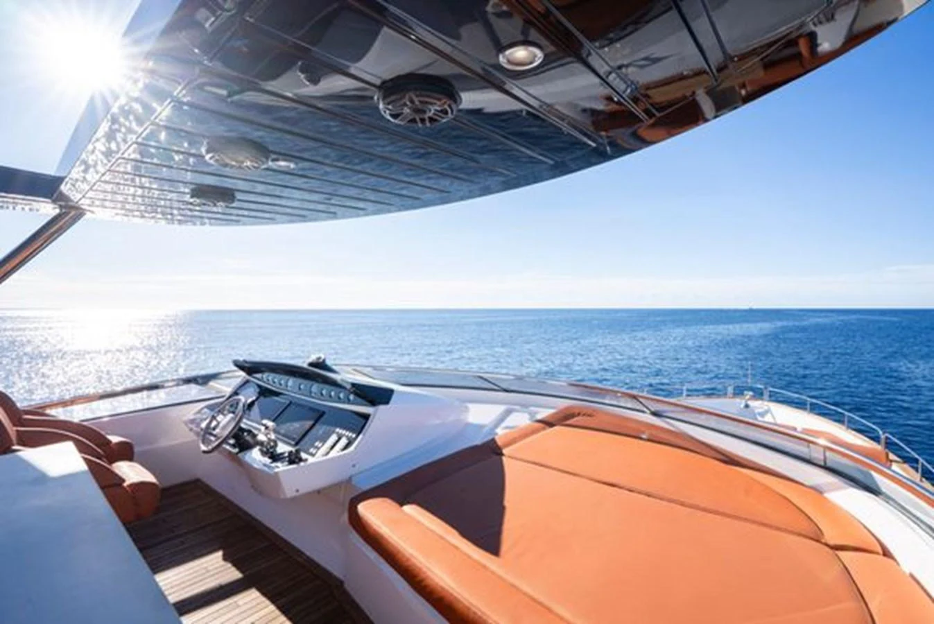 The flybridge offers a stunning view of the open sea with luxurious seating and a sleek helm station. aboard 2015 SUNSEEKER 28M RIII Yacht for Sale