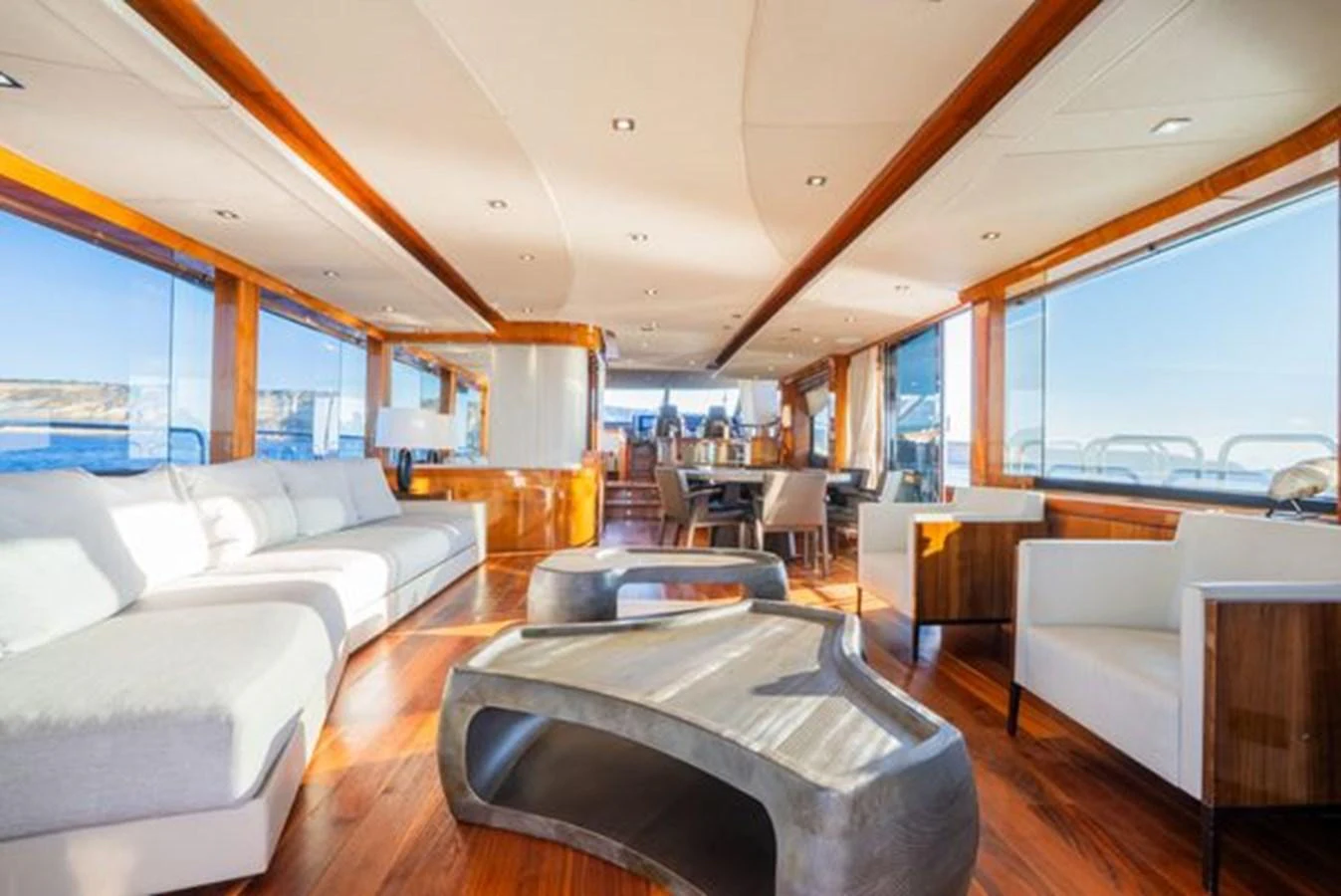 The spacious salon features modern furnishings and panoramic windows for a luxurious experience. aboard 2015 SUNSEEKER 28M RIII Yacht for Sale