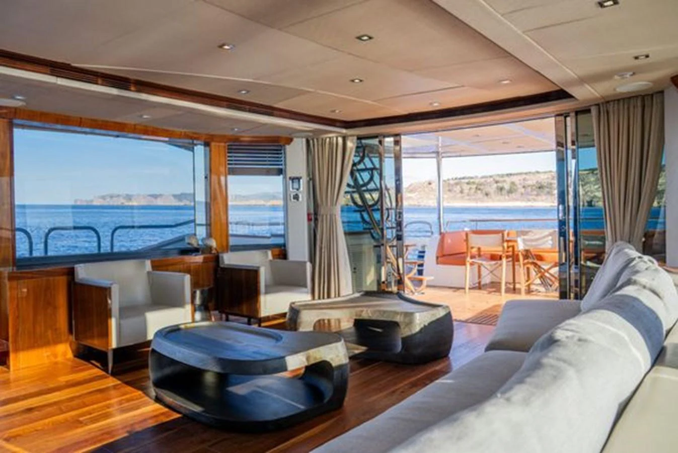 The yacht's salon features luxurious seating with panoramic views of the surrounding waters. aboard 2015 SUNSEEKER 28M RIII Yacht for Sale