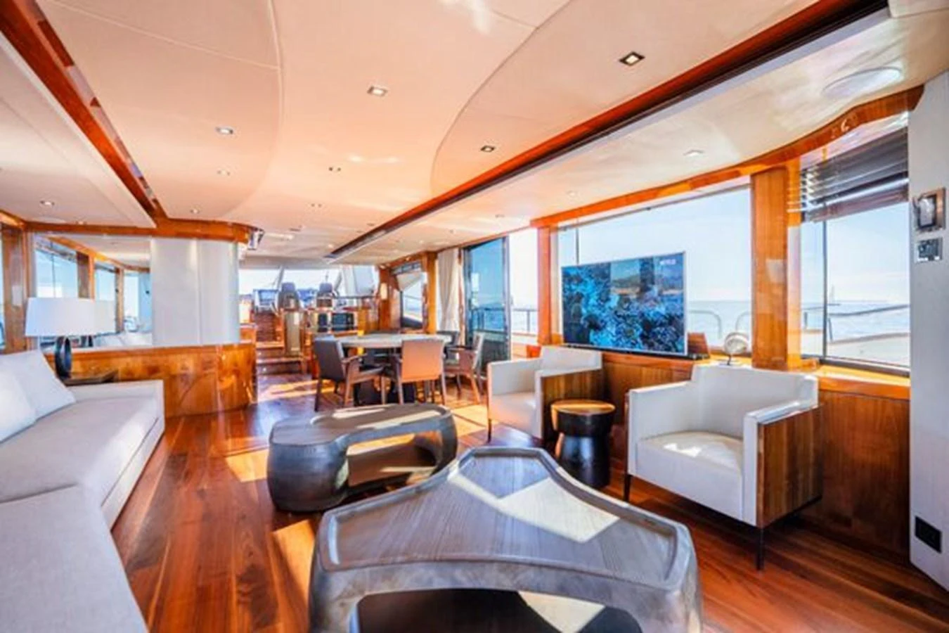 The yacht's salon features elegant seating and large windows for panoramic views. aboard 2015 SUNSEEKER 28M RIII Yacht for Sale