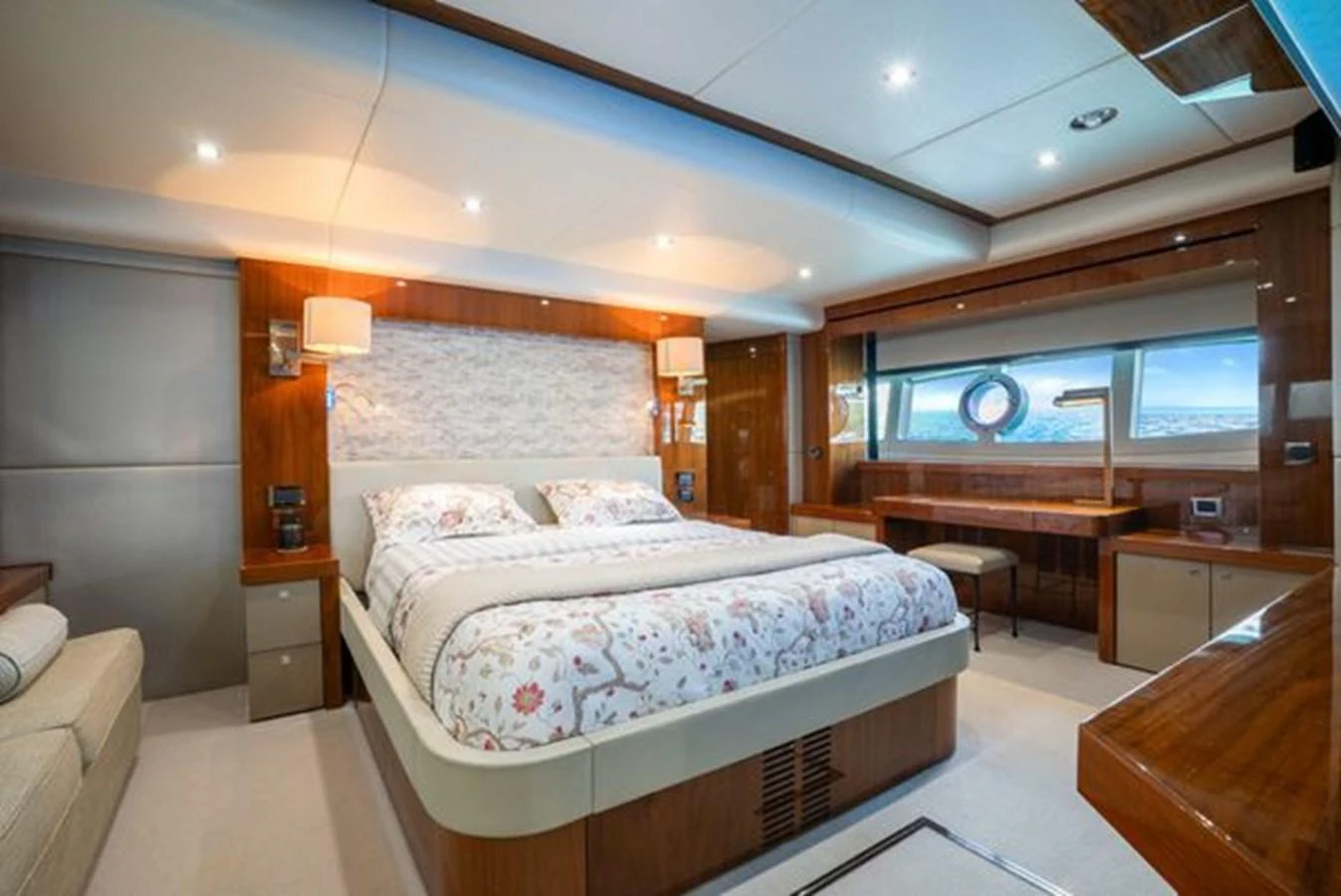 The master stateroom features a luxurious bed with elegant bedding and ample natural light. aboard 2015 SUNSEEKER 28M RIII Yacht for Sale