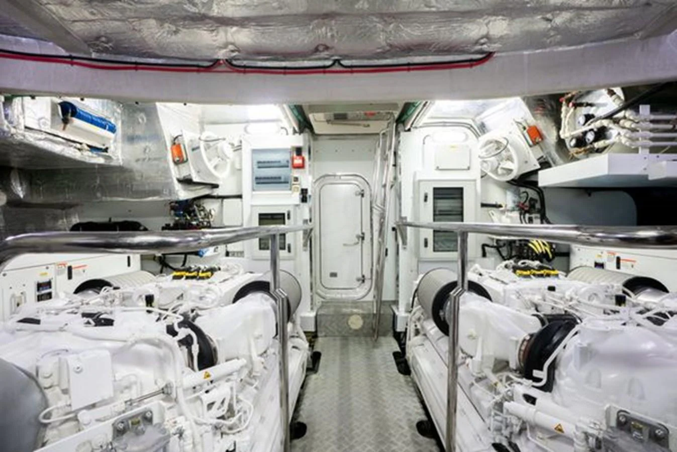 The yacht's engine room showcases its powerful and meticulously maintained machinery. aboard 2015 SUNSEEKER 28M RIII Yacht for Sale