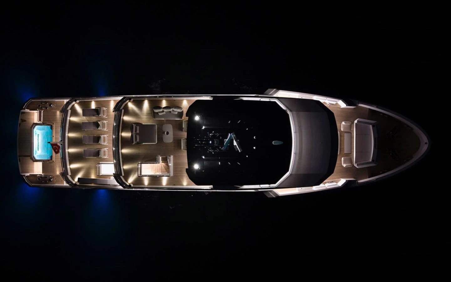 A stunning aerial view of a yacht illuminated at night, showcasing its elegant design and luxurious amenities. aboard BEE EXPLORER YACHT Yacht for Sale