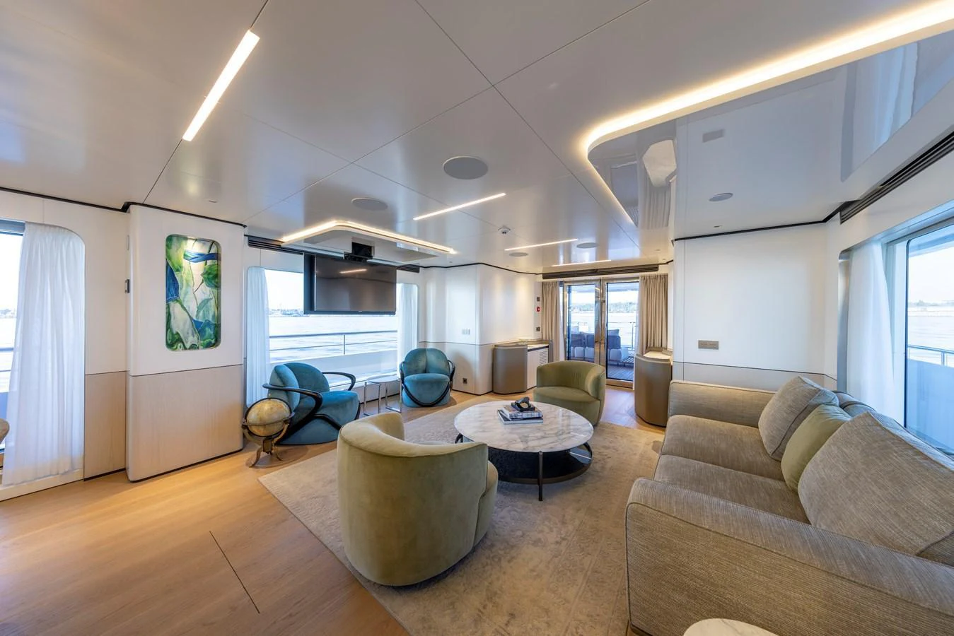 The salon features a spacious and modern design with comfortable seating and large windows for natural light. aboard BEE EXPLORER YACHT Yacht for Sale