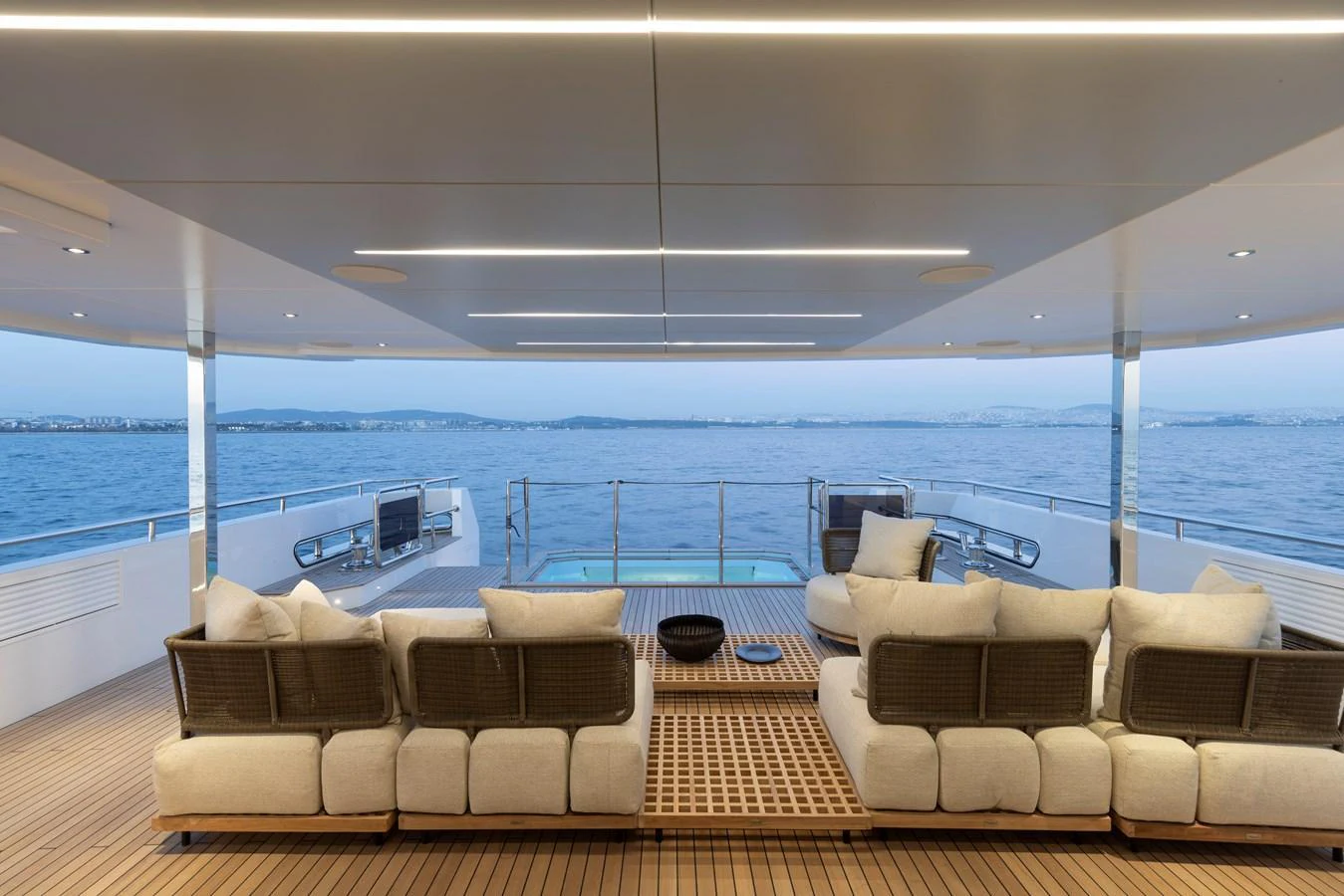 The aft deck offers a luxurious seating area with stunning ocean views. aboard BEE EXPLORER YACHT Yacht for Sale