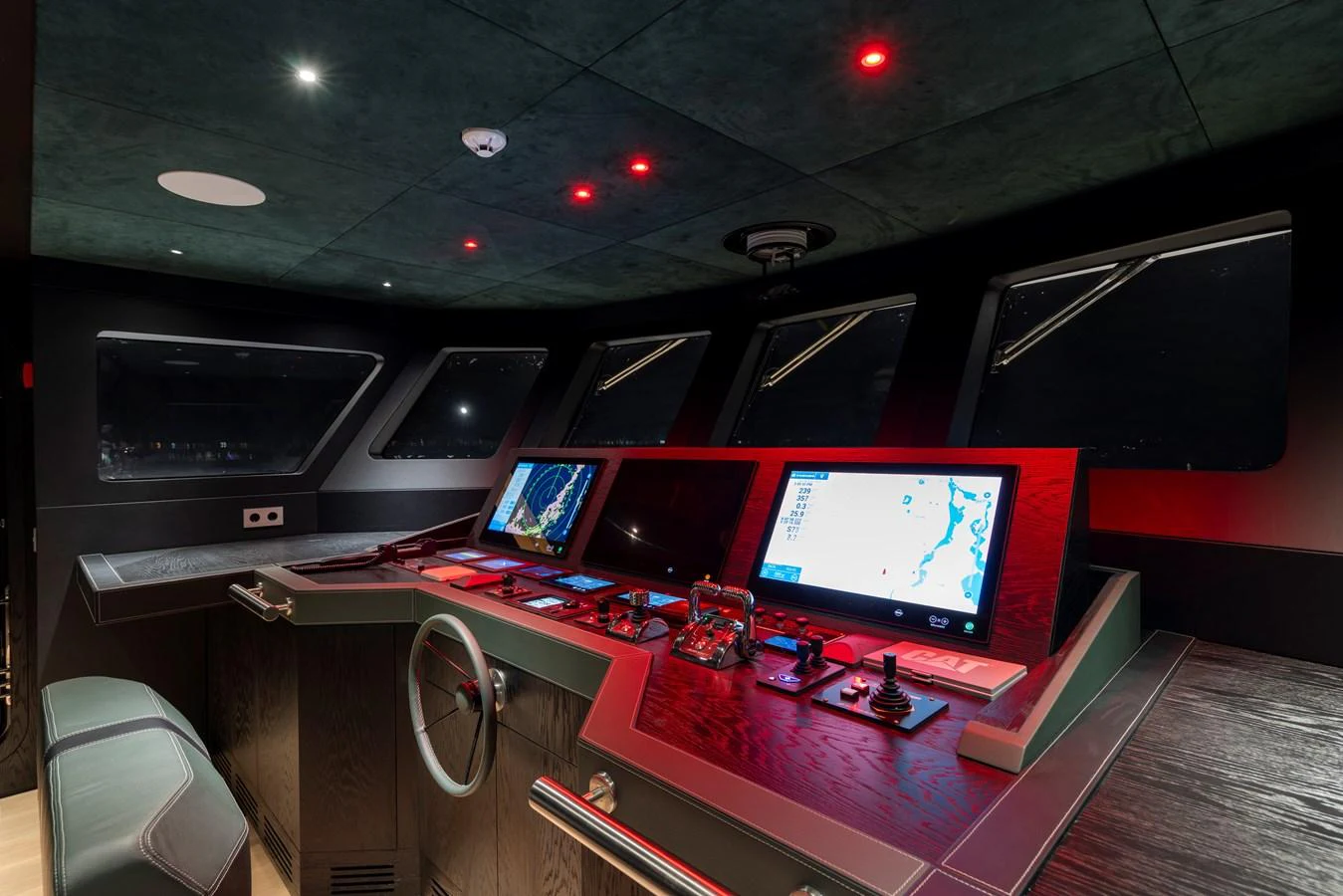 The helm station features advanced navigation equipment and a sleek, modern design. aboard BEE EXPLORER YACHT Yacht for Sale