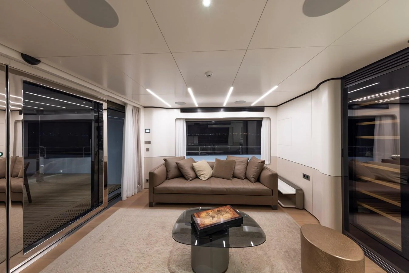 The yacht's salon features a comfortable seating area with modern furnishings and elegant lighting. aboard BEE EXPLORER YACHT Yacht for Sale