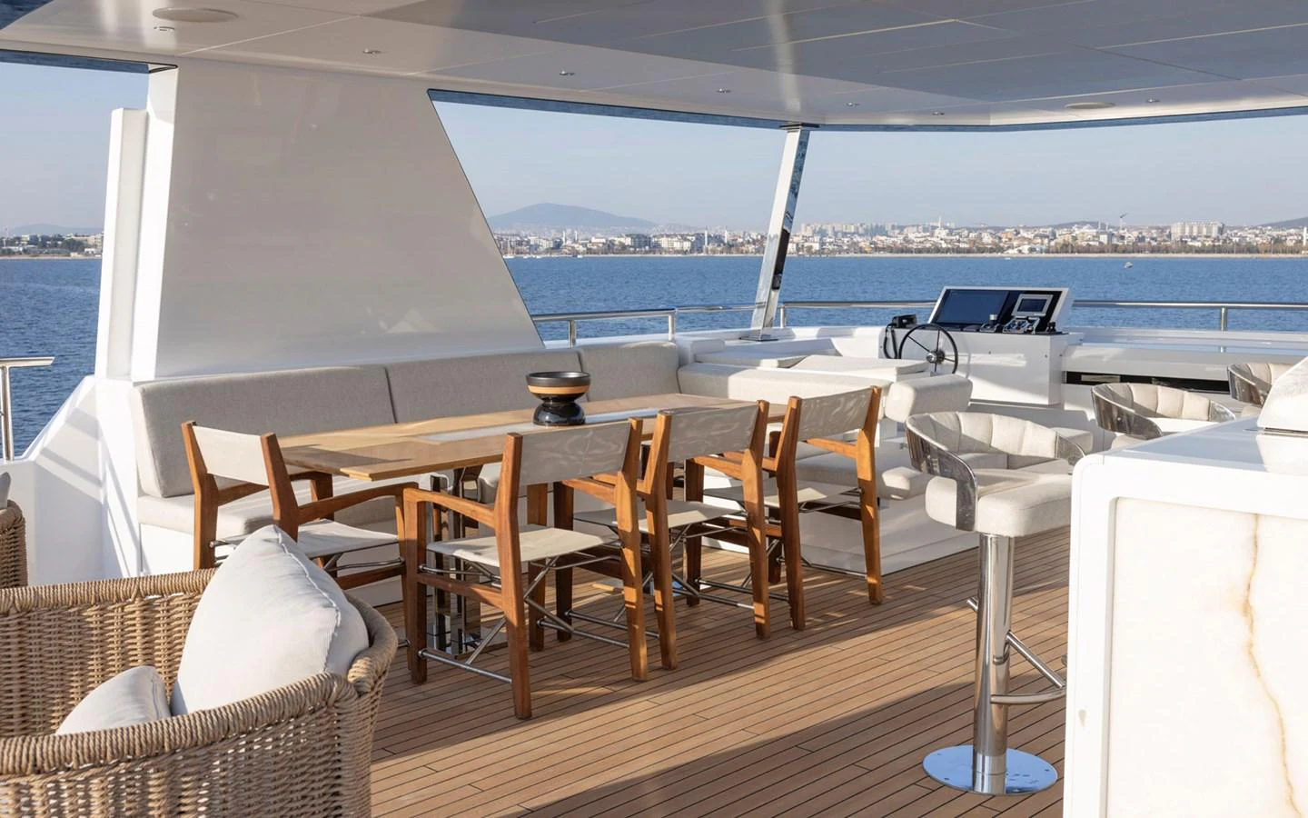 The aft deck features a spacious dining area with comfortable seating and stunning views. aboard BEE EXPLORER YACHT Yacht for Sale